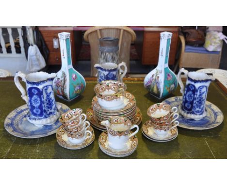 A late Victorian Staffordshire tea service, a graduated set of 3 late Victorian pottery jugs, a pair of German porcelain vase