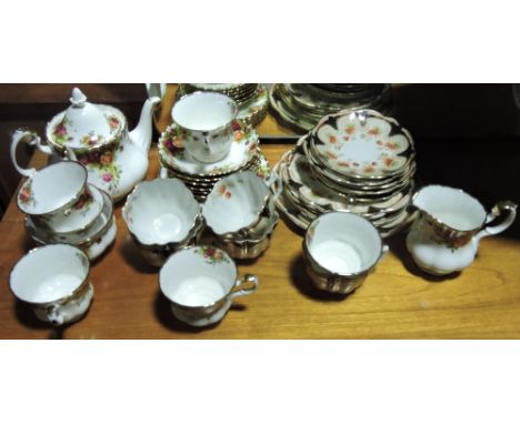 A Royal Albert 'Old Country Roses' porcelain 20 piece part tea service  together with an Edwardian 18 piece part tea service
