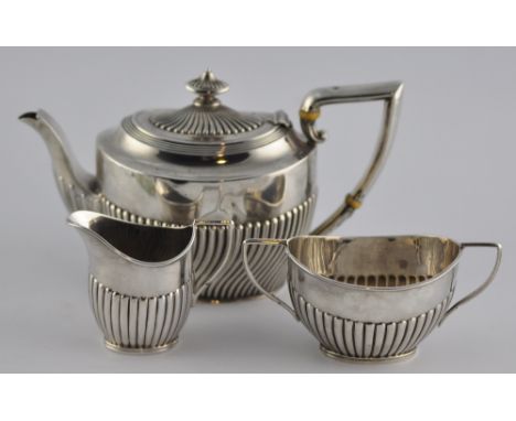 A late Victorian Scottish silver bachelor's teapot with wrythen fluted body, Glasgow 1893 together with an associated Chester