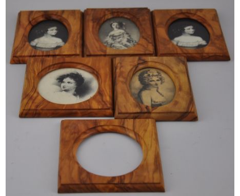 A quantity of assorted monochrome portrait photographs together with a larger quantity of rectangular olive wood frames