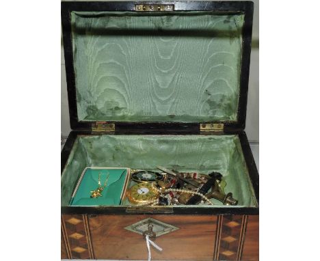 An assortment of costume jewellery, enamel badges, timepieces, etc., including some gold and silver, in an Edwardian inlaid w