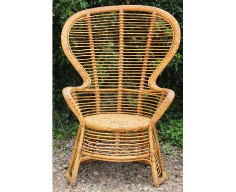 A VINTAGE BAMBOO AND CANED PEACOCK CHAIR with cerda label, 88cm wide x 124cm high