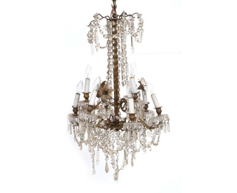 AN OLD HANGING NINE-LIGHT ELECTROLIER with gilt metal lily flowers and hanging cut glass drop swags, approximately 65cm high 