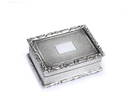 AN ELIZABETH II SILVER VINAIGRETTE with engine turned and cast decoration to the box and with a pierced hinged cast grill wit