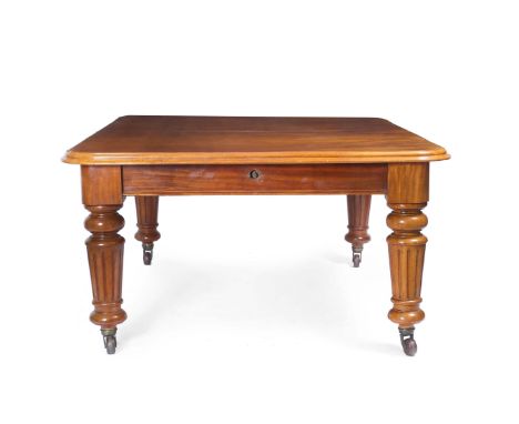 A VICTORIAN MAHOGANY WIND OUT EXTENDING DINING TABLE, with turned tapering fluted legs terminating in ceramic casters, and co