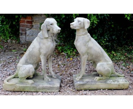 A PAIR OF COMPOSITE STONE HUNTING DOGS, after a 19th century pair by Henri Alfred De Jacquemart, each sitting on haunches, on