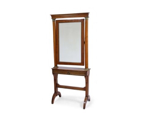 AN EMPIRE CHESTNUT OR POSSIBLY BIRCH WOOD CHEVAL MIRROR with gilt metal mounts to the columns supporting the rectangular hing