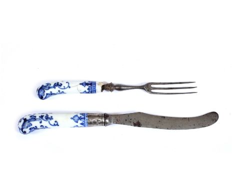 A MID 18TH CENTURY KNIFE AND FORK with Worcester pistol grip shaped blue and white decorated handles, the knife blade stamped