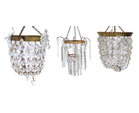 A GROUP OF THREE VARIOUS BAG TYPE HANGING LIGHT FITTINGS with cut glass drops, the largest 32cm diameter together with a furt