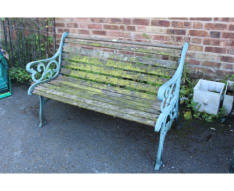 A GARDEN BENCH WITH CAST LEGS