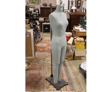 A VINTAGE MANNEQUIN ON STAND 