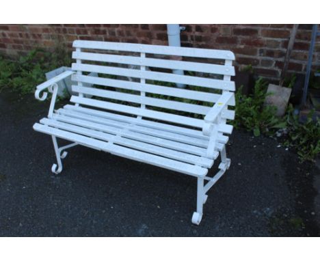 A PAINTED WHITE GARDEN BENCH