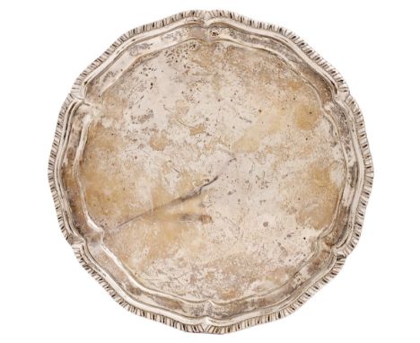 An Irish George II silver salver, with gadrooned rim, on fluted feet, 20.5cm diam, marks rubbed, Dublin 1735, 12oz 3dwt  Prov