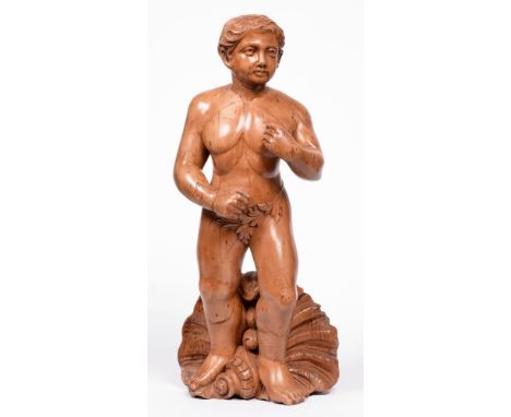 A carved walnut figure of Poseidon, c.1900, standing before a shell, 62cm h  Missing item from hands, likely a trident