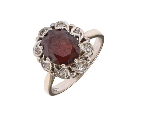 A synthetic ruby and diamond ring, illusion set in white gold, marked 18ct, 5.3g, size M  Good condition