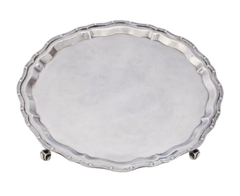 An Elizabeth II silver salver, on four volute feet, 31cm diam, by Garrard &amp; Co Ltd, Birmingham 1971, 26oz 17dwt  Good con