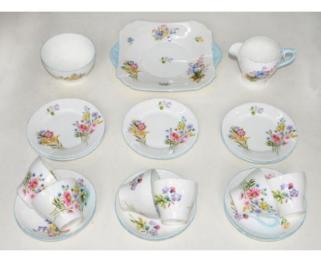 A Shelley bone china tea service, c1920,&nbsp;decorated with flowers, two handled plate 24cm over handles, printed mark (21) 