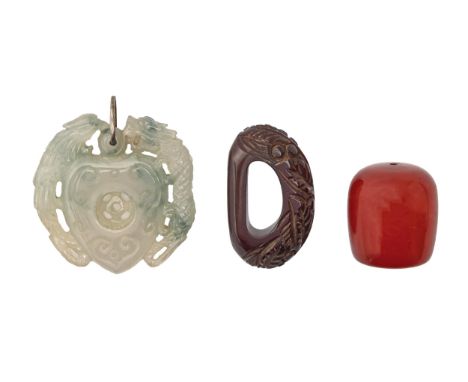 A South East Asian carved and pierced jade pendant, 50mm h, a Faturan bead and a carved Faturan scarf ring (3)  Undamaged
