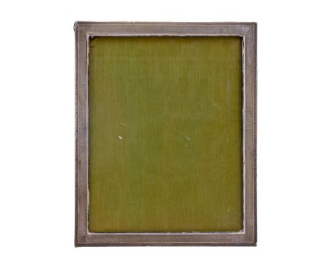 A George V silver photograph frame, engine turned, backed on oak, 29cm x 24cm, maker's mark rubbed, Birmingham 1927  Generall