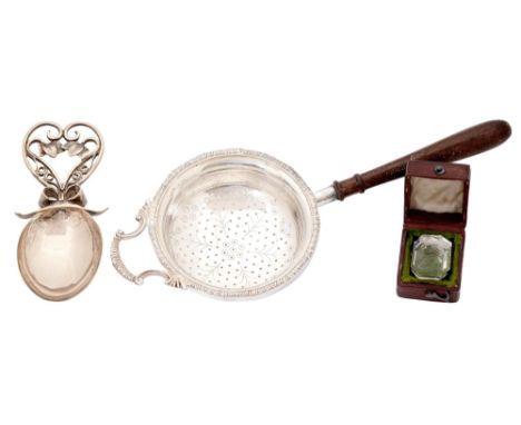 A silver caddy spoon with wirework handle, 90mm l, unmarked, a silver tea strainer, wood handle, Birmingham 1961, and a Victo