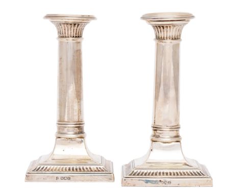 A pair of George V dwarf columnar silver candlesticks, nozzles, 15.5cm h, by Thomas Bradbury &amp; Sons Ltd, Sheffield 1920, 