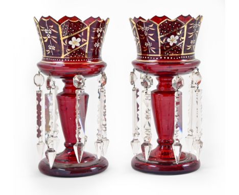 A pair of ruby glass lustres, late 19th c, with gilt rim and enamelled flowers and prismatic cut glass beads and pendants, 31