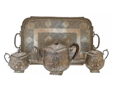 An Indian colonial silver tea service, Kashmir, c1890, of rounded square shape, the conforming foot at an angle of 45° to the