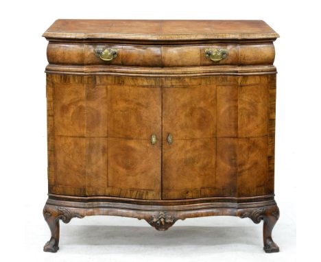 A German serpentine walnut commode, c.1920,&nbsp;in matched veneers, 89cm h; 57 x 93cm  