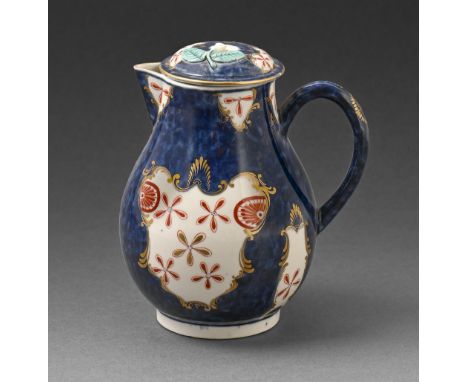 A Worcester hot milk jug and cover, c.1770, painted in a Japan style, 12cm h, fretted square in underglaze blue  Loss of flow