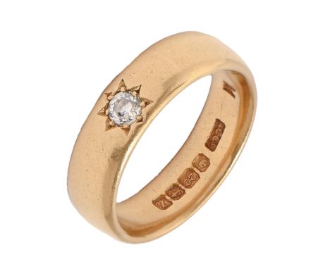 A diamond ring, with a single old cut diamond, set in a 22ct gold wedding ring, Birmingham 1924, 7.1g, size J  Good condition