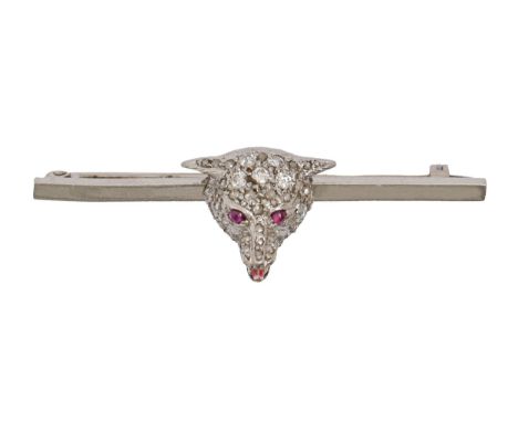 A ruby, diamond and enamel fox head tie pin, in platinum, 51mm l, 11.5g  Enamel very slightly chipped, evident under 10x magn