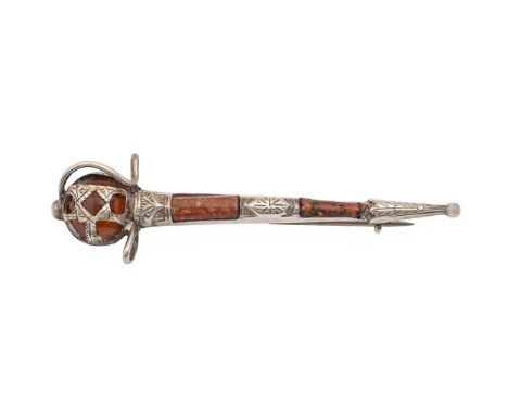 A silver and Scottish hardstone claymore brooch, early 20th c, 66mm l, maker J C &amp; F and marked SILVER, 4.9g  Light fault