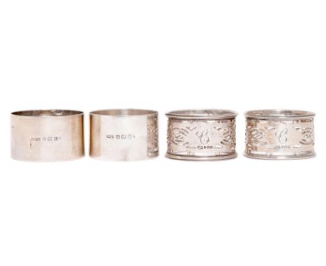 Two pairs of George V silver napkin rings, one by Henry Williamson Ltd, the other by Fergenbaum & Son, both Birmingham, 1915 