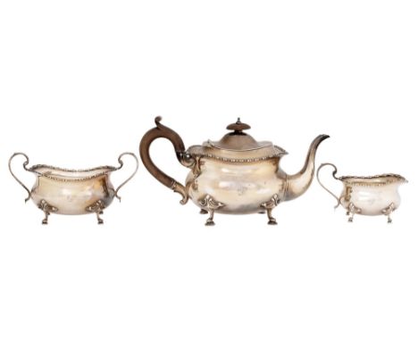 An Edwardian silver three piece tea service, of oval form with reeded rim,&nbsp; teapot 14cm h, by Williams (Birmingham) Ltd,