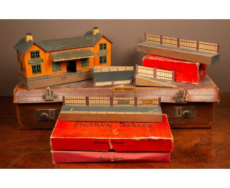 An 0 gauge scale Bing of Germany tin plate station with platform sections to either side and station label 'New Street' toget