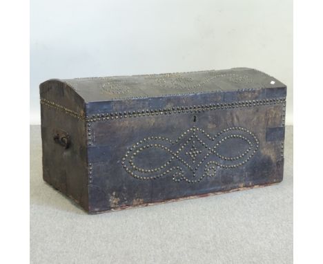 An 18th century leather and iron bound dome top trunk, with studwork decoration inscribed JB, 79cm