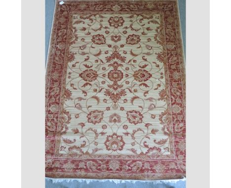 A Ziegler carpet, with red scrolling designs, on an ivory coloured field, 280 x 200cm 