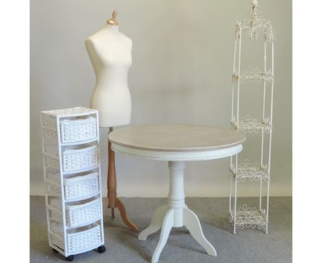 A white painted circular occasional table, together with a dressmaker's mannequin, a metal four tier plant stand and a chest 