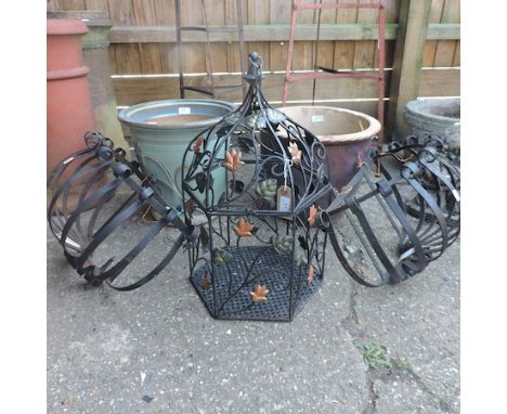 A pair of garden planters, together with a pair of wrought iron wall pockets, 53cm, and a lantern