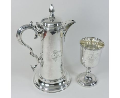 A Victorian silver plated flagon, of large proportions, the ornate scrolled handle with a heart shaped terminal and hinged li