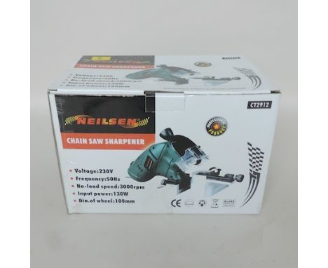 A chainsaw sharpener, boxed