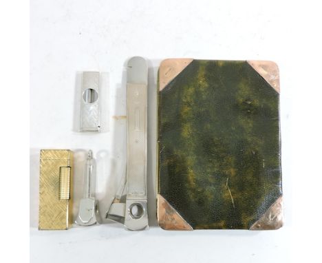 A 9 carat gold mounted wallet, together with a cigarette lighter, stamped Dunhill, and three cigar cutters