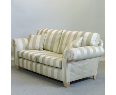 A contemporary gold and cream striped sofa, 210cm