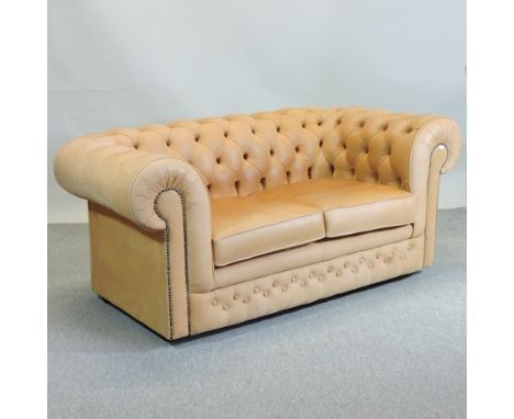 A Thomas Lloyd tan upholstered chesterfield sofa, 164cm