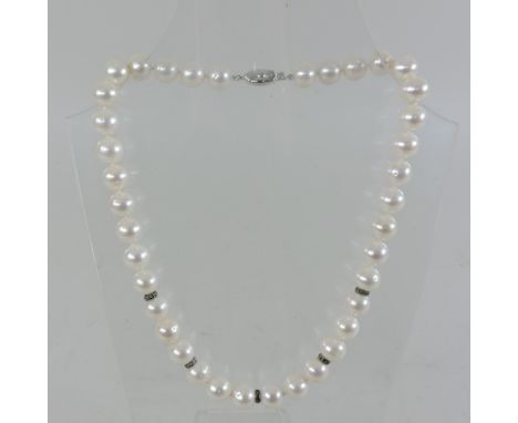 A pearl and gem set necklace, with a white metal clasp