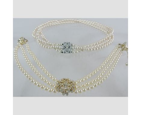 A simulated pearl three strand necklace, together with another, cased 