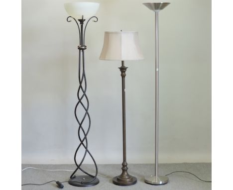A modern brushed steel standard lamp, together with two others 