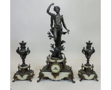 A 19th century French bronzed figural three piece clock garniture, Le Reveil du Zephir, after Bruchon, on a white marble, gil