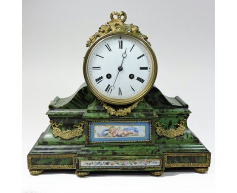 A French simulated green tortoiseshell and gilt metal mounted mantel clock, inset with a Sevres style porcelain plaque, the w