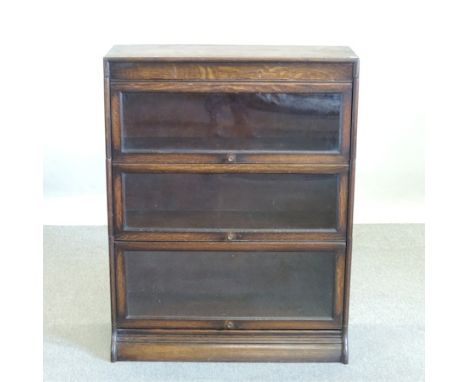 An early 20th century oak Globe Wernicke style three tier glazed bookcase, 87cm